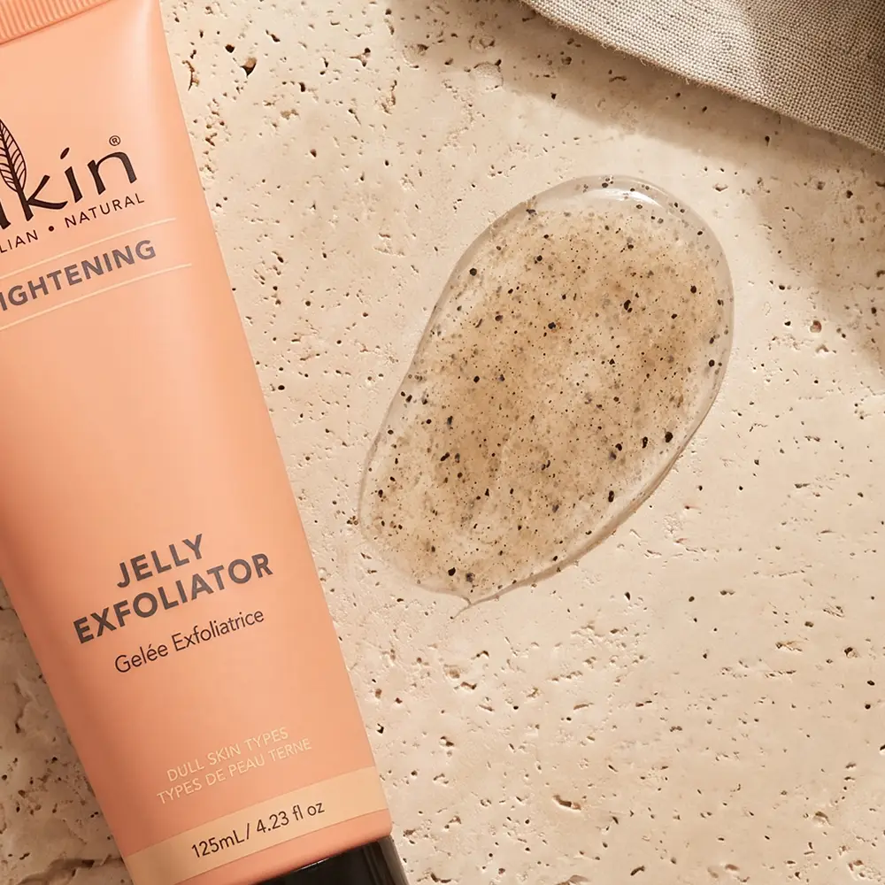 Sukin exfoliator tube beside a translucent jelly texture swatch